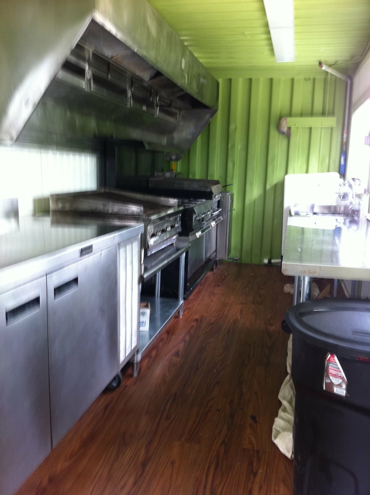 Shipping container kitchen interior with full equipment line